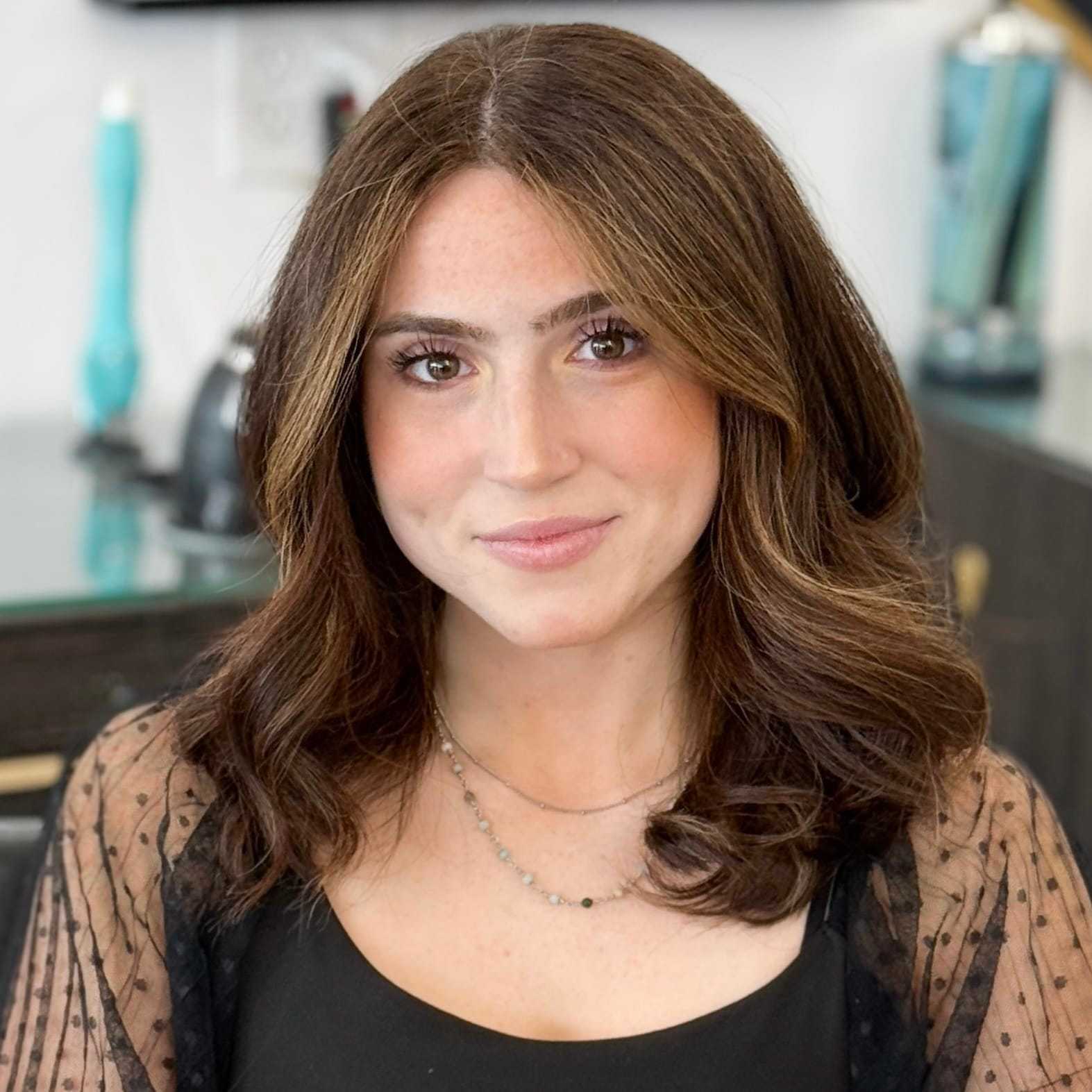 Portrait of Daniella, a professional stylist at Salon Blissful Med Spa, showcasing their expertise and style.