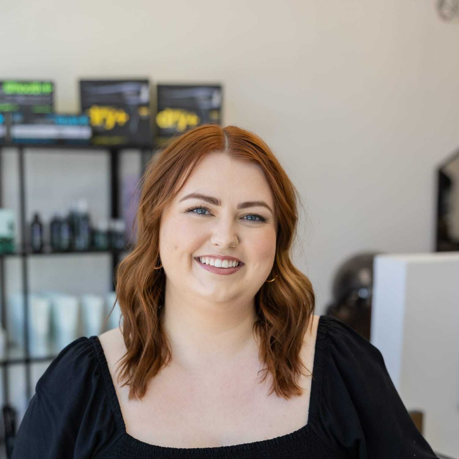 Portrait of Grace, a professional stylist at Salon Blissful Med Spa, showcasing their expertise and style.