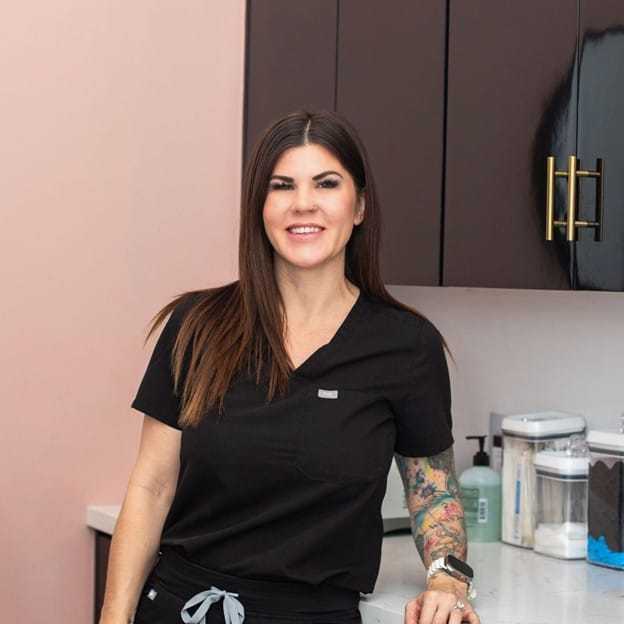 Portrait of Leslie, a professional stylist at Salon Blissful Med Spa, showcasing their expertise and style.