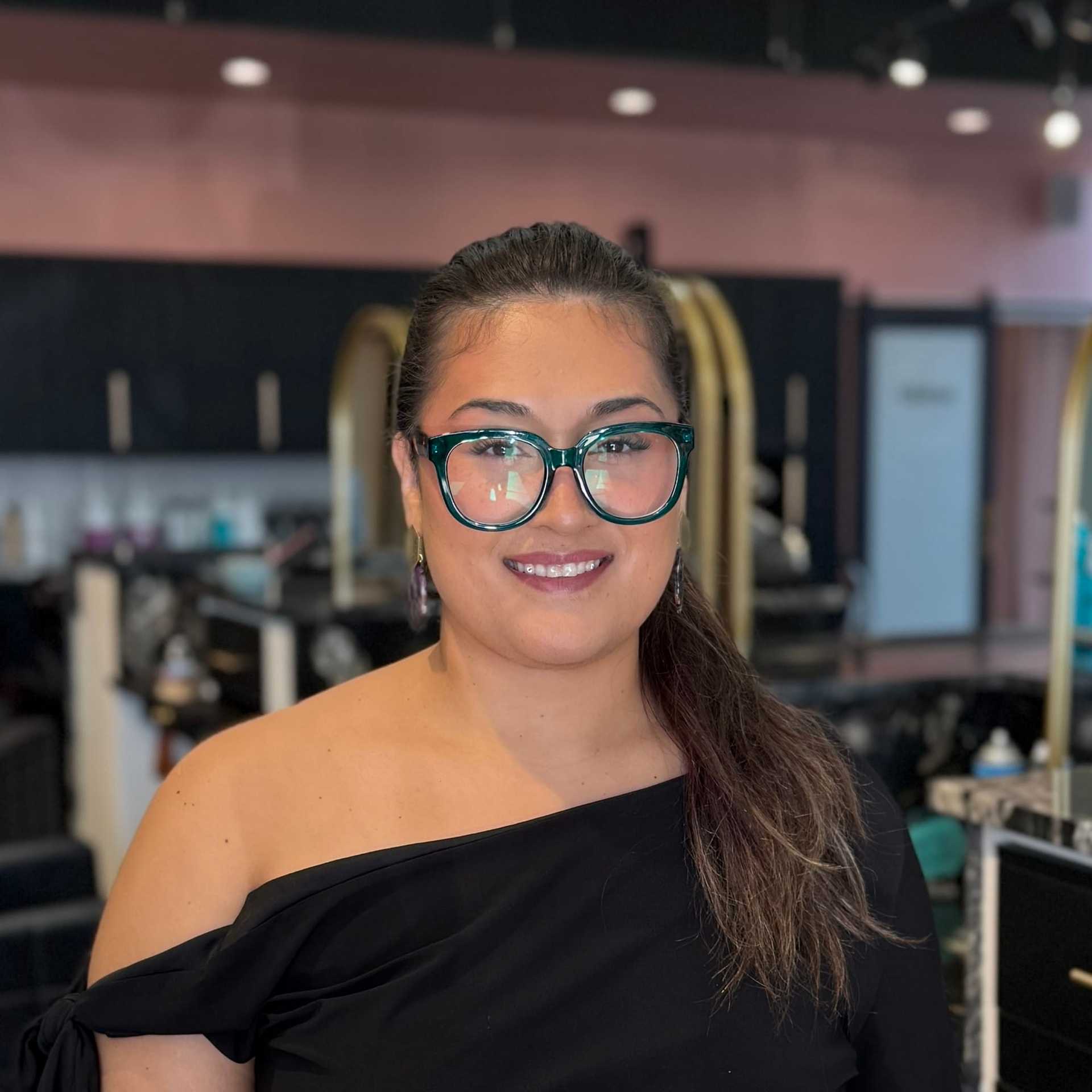 Portrait of Teyah, a professional stylist at Salon Blissful Med Spa, showcasing their expertise and style.