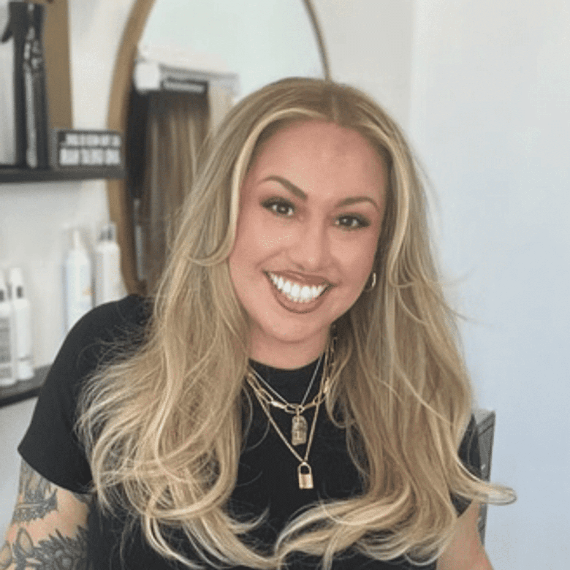 Portrait of CJ, a professional stylist at Salon Blissful Med Spa, showcasing their expertise and style.